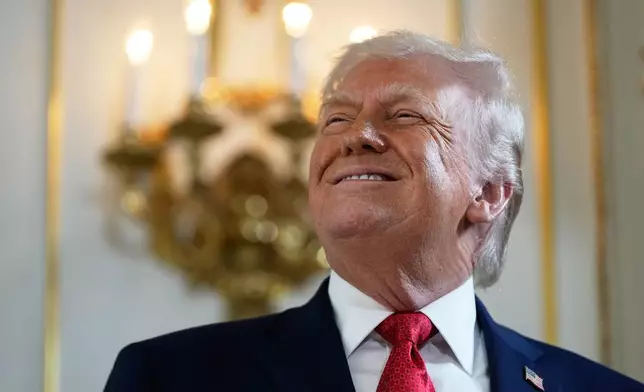 President Donald Trump arrives at a dedication ceremony for a portion of Southern Boulevard, which the Town of Palm Beach Council recently voted to rename,"President Donald J. Trump Boulevard," Friday, Jan. 16, 2026, at his Mar-a-Lago Club in Palm Beach, Fla. (AP Photo/Julia Demaree Nikhinson)