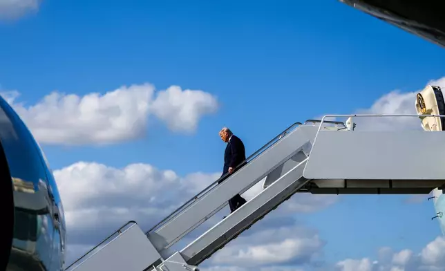 President Donald Trump disembarks Air Force One at Palm Beach International Airport, Friday, Jan. 16, 2026, in West Palm Beach, Fla. (AP Photo/Julia Demaree Nikhinson)