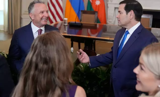 FILE - Special Presidential Envoy Steve Witkoff, left, and Secretary of State Marco Rubio arrive before a trilateral signing ceremony with Azerbaijan's President Ilham Aliyev and Armenia's Prime Minister Nikol Pashinyan in the State Dining Room of the White House, Aug. 8, 2025, in Washington. (AP Photo/Mark Schiefelbein, File)