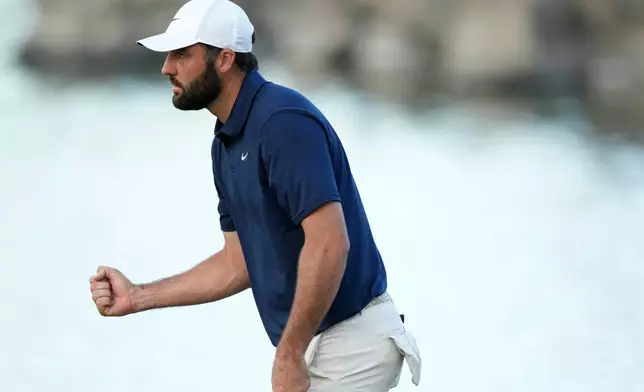 Scottie Scheffler pumps his fist after making a par on the 18th hole during the third round of the American Express golf event on the Pete Dye Stadium Course at PGA West Saturday, Jan. 24, 2026, in La Quinta, Calif. (AP Photo/Ross D. Franklin)