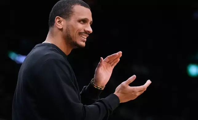 Boston Celtics head coach Joe Mazzulla applauds towards his players during the first half of an NBA basketball game against the Chicago Bulls, Monday, Jan. 5, 2026, in Boston. (AP Photo/Charles Krupa)