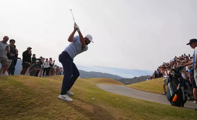Scottie Scheffler hits his ball out of the rough on the ninth hole during the final round of the American Express golf event on the Pete Dye Stadium Course at PGA West Sunday, Jan. 25, 2026, in La Quinta, Calif. (AP Photo/Ross D. Franklin)