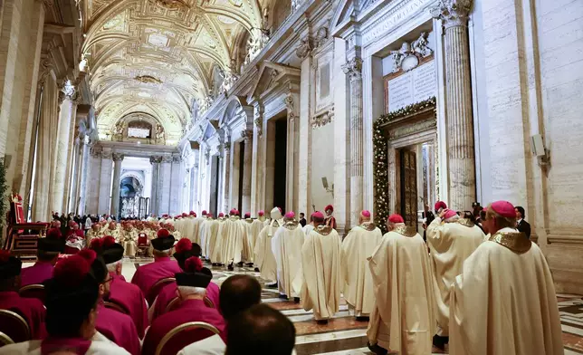 Members of the clergy arrive ahead of Pope Leo XIV for the closing of the Holy Door of St. Peter's Basilica to end the 2025 ordinary Jubilee year, at the Vatican, Tuesday, Jan. 6, 2026. (Yara Nardi/Pool photo via AP)