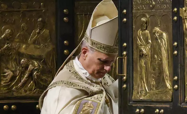 Pope Leo XIV closes St. Peter's Basilica Holy Door to end the 2025 ordinary Jubilee year, at the Vatican, Tuesday, Jan. 6, 2025. (Yara Nardi/Pool photo via AP)