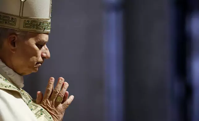 Pope Leo XIV closes St. Peter's Basilica Holy Door to end the 2025 ordinary Jubilee year, at the Vatican, Tuesday, Jan. 6, 2026. (Yara Nardi/Pool photo via AP)