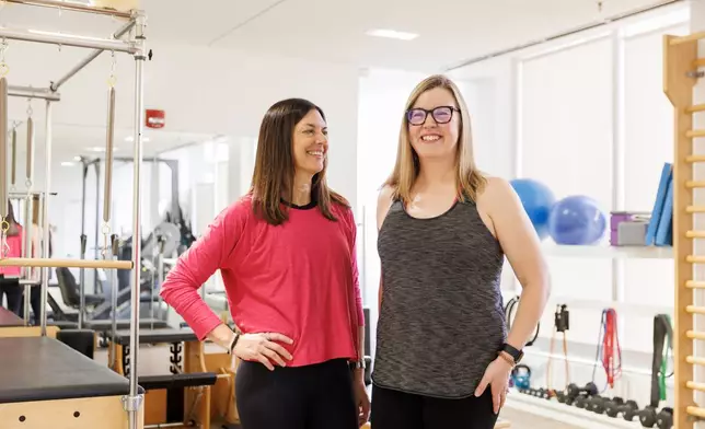 Hilary Granat, left, and her client, Sarah Baldassaro, pose for a portrait at the Center for Orthopedic Rehab and Exercise on Thursday, Jan. 8, 2026, in Washington. (AP Photo/Moriah Ratner)