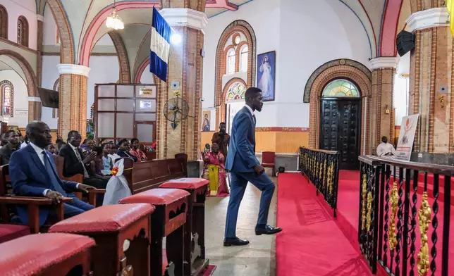 Uganda's leading opposition presidential candidate, Bobi Wine, attends a church service at the Rubaga Cathedral in Kampala, Uganda, Thursday, Jan. 1, 2026. (AP Photo/Hajarah Nalwadda)