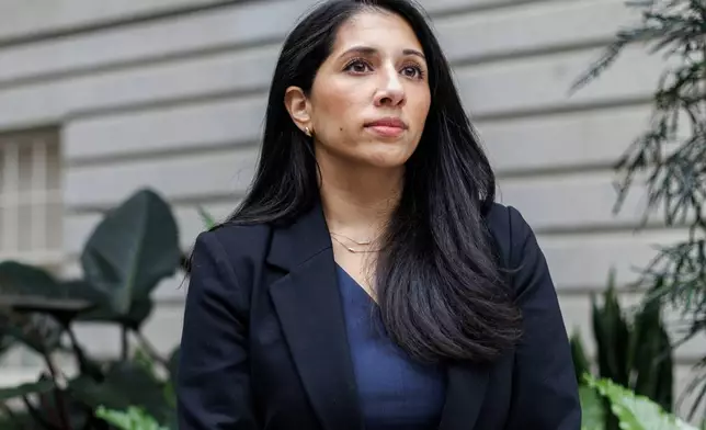Anam Petit, a former Justice Department employee, poses for a portrait in the Robert and Arlene Kogod Courtyard at the National Portrait Gallery in Washington, Friday, Jan. 9, 2026. (AP Photo/Moriah Ratner)