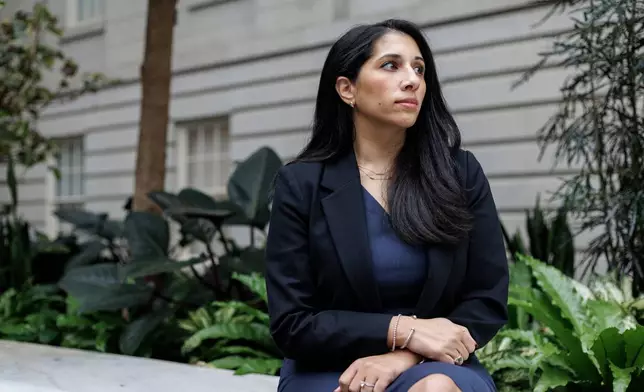 Anam Petit, a former Justice Department employee, poses for a portrait in the Robert and Arlene Kogod Courtyard at the National Portrait Gallery in Washington, Friday, Jan. 9, 2026. (AP Photo/Moriah Ratner)