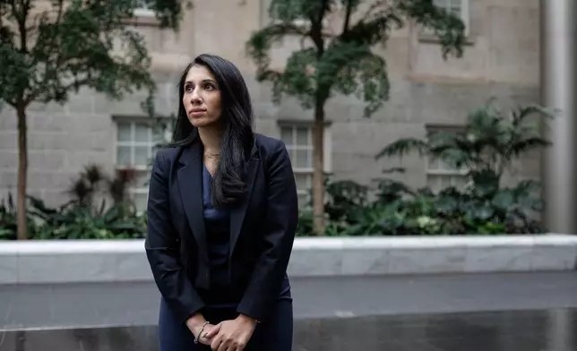 Anam Petit, a former Justice Department employee, poses for a portrait in the Robert and Arlene Kogod Courtyard at the National Portrait Gallery in Washington, Friday, Jan. 9, 2026. (AP Photo/Moriah Ratner)