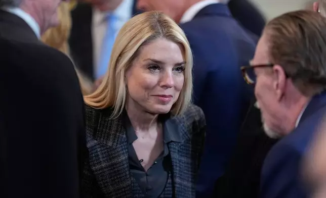 Attorney General Pam Bondi arrives before President Donald Trump speaks during an event to honor the 2025 Stanley Cup Champion Florida Panthers in the East Room of the White House, Thursday, Jan. 15, 2026, in Washington. (AP Photo/Alex Brandon)