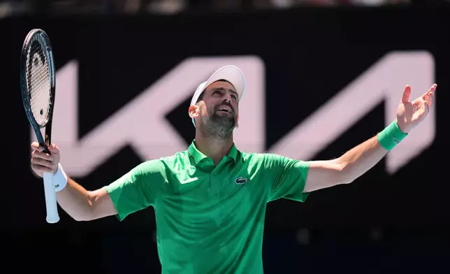 Novak Djokovic of Serbia reacts during his second round match against Francesco Maestrelli of Italy at the Australian Open tennis championship in Melbourne, Australia, Thursday, Jan. 22, 2026. (AP Photo/Aaron Favila)