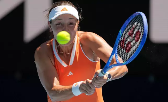 Jessica Pegula of the U.S. plays a backhand return to compatriot McCartney Kessler during their second round match at the Australian Open tennis championship in Melbourne, Australia, Thursday, Jan. 22, 2026. (AP Photo/Aaron Favila)