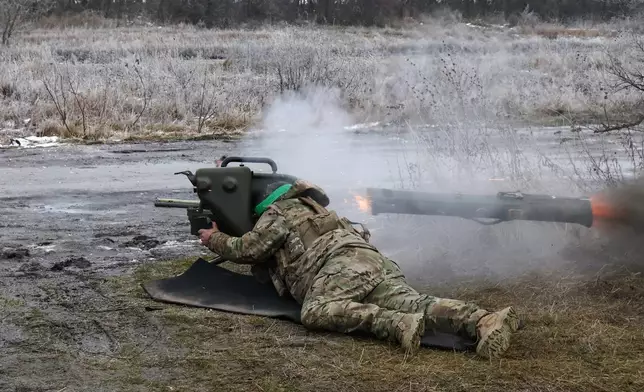 In this photo provided by Ukraine's 65th Mechanized Brigade press service, a soldier fires a MILAN, a Franco-German anti-tank missile system, during a drill close to the frontline on the site of heavy battles with the Russian troops in the Zaporizhzhia region, Ukraine, Sunday, Jan. 4, 2026. (Andriy Andriyenko/Ukraine's 65th Mechanized Brigade via AP)