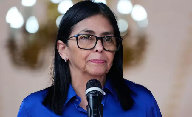 Venezuela's acting President Delcy Rodriguez makes a statement to the press at Miraflores presidential palace in Caracas, Venezuela, Wednesday, Jan. 14, 2026. (AP Photo/Ariana Cubillos)