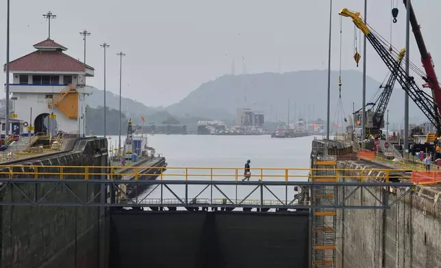 FILE - Workers carry out maintenance at the Pedro Miguel locks of the Panama Canal during routine upkeep in Panama City, Friday, May 30, 2025. (AP Photo/Matias Delacroix, File)