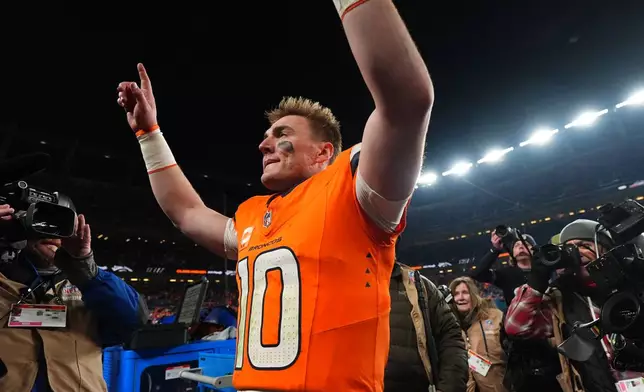 Denver Broncos quarterback Bo Nix celebrates after an NFL divisional round playoff football game against the Buffalo Bills, Saturday, Jan. 17, 2026, in Denver. (AP Photo/Jack Dempsey)