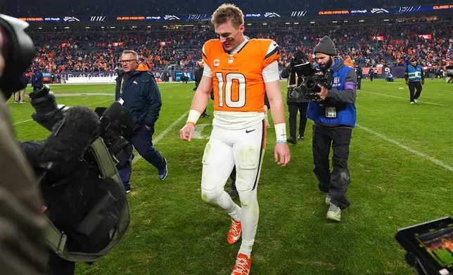 Denver Broncos quarterback Bo Nix leaves the field after an NFL divisional round playoff football game against the Buffalo Bills, Saturday, Jan. 17, 2026, in Denver. (AP Photo/Jack Dempsey)