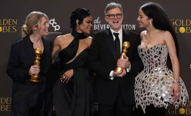 Sara Murphy, from left, Teyana Taylor, Paul Thomas Anderson, and Chase Infiniti pose in the press room with the award for best motion picture – musical or comedy for "One Battle After Another" during the 83rd Golden Globes on Sunday, Jan. 11, 2026, at the Beverly Hilton in Beverly Hills, Calif. (AP Photo/Chris Pizzello)