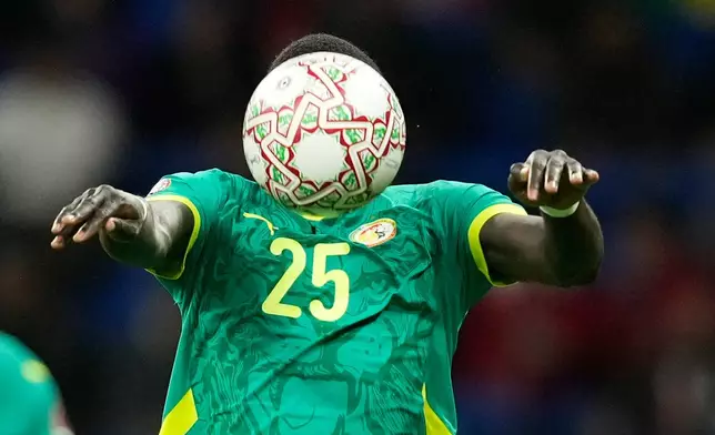 Senegal's El Hadji Malick Diouf heads the ball during the Africa Cup of Nations best of 16 soccer match between Senegal and Sudan in Tangier, Morocco, Saturday, Jan. 3, 2026. (AP Photo/Mosa'ab Elshamy)