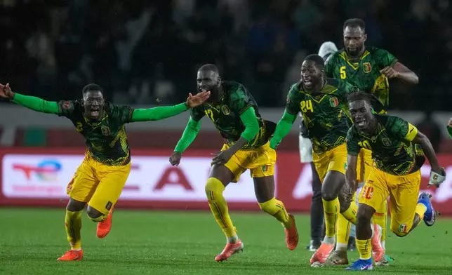Mali players celebrate after the penalty shootout og the Africa Cup of Nations best of 16 soccer match between Mali and Tunisia in Casablanca, Morocco, Saturday, Jan. 3, 2026. (AP Photo/Themba Hadebe)
