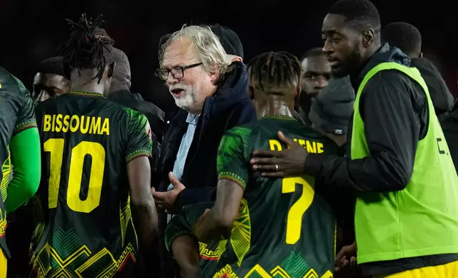 Mali's head coach Tom Saintfiet talks to players before the ectra time during the Africa Cup of Nations best of 16 soccer match between Mali and Tunisia in Casablanca, Morocco, Saturday, Jan. 3, 2026. (AP Photo/Themba Hadebe)