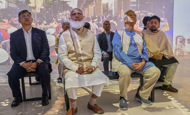 Head of Bangladesh's interim government Muhammad Yunus, second right, with Bangladesh Jamaat-e-Islami party leader Ameer Shafiqur Rahman, second left, watch an audio visual during the inauguration of the July Uprising Memorial Museum, once the official residence of Bangladesh's ousted Prime Minister Sheikh Hasina, in Dhaka, Bangladesh, Tuesday, Jan. 20, 2026. (AP Photo/Mahmud Hossain Opu)
