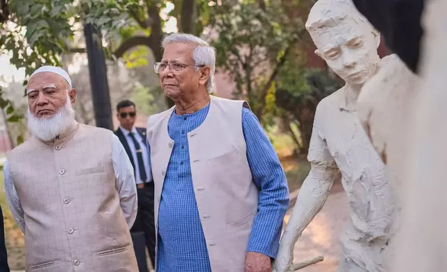 Head of Bangladesh's interim government Muhammad Yunus, center, with Bangladesh Jamaat-e-Islami party leader Ameer Shafiqur Rahman, inaugurate the July Uprising Memorial Museum, once the official residence of Bangladesh's ousted Prime Minister Sheikh Hasina, in Dhaka, Bangladesh, Tuesday, Jan. 20, 2026. (AP Photo/Mahmud Hossain Opu)