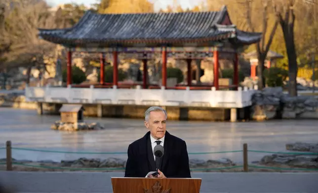 Canada's Prime Minister Mark Carney, speaks to the media at Ritan Park in Beijing, China, Friday, Jan. 16, 2026. (AP Photo/Vincent Thian)
