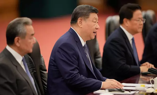 Chinese President Xi Jinping, centre, reacts during a meeting with Canada's Prime Minister Mark Carney (not in the picture), at the Great Hall of the People in Beijing, China, Friday, Jan. 16, 2026. (AP Photo/Vincent Thian, Pool)