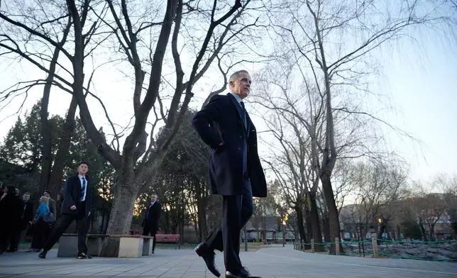 Canada's Prime Minister Mark Carney, leaves after speaking to the media at Ritan Park in Beijing, China, Friday, Jan. 16, 2026. (AP Photo/Vincent Thian)