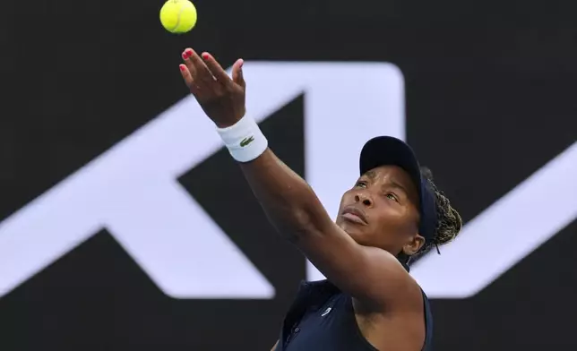 Venus Williams of the U.S. serves to Olga Danilovic of Serbia during their first round match at the Australian Open tennis championship in Melbourne, Australia, Sunday, Jan. 18, 2026. (AP Photo/Aaron Favila)