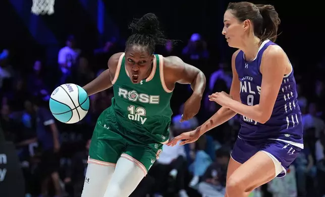 Rose BC guard Chelsea Gray (12) drives past Lunar Owls wing Rebecca Allen (9) in their Unrivaled 3-on-3 basketball game, Monday, Jan. 5, 2026, in Medley, Fla. (AP Photo/Rebecca Blackwell)