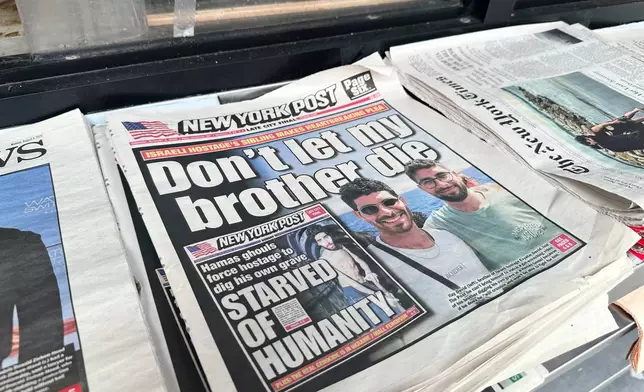 FILE - The New York Post is seen at a newsstand in Manhattan, Aug. 4, 2025. (AP Photo/Jennifer Peltz, File)