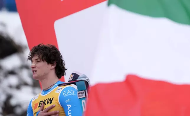 Italy's Giovanni Franzoni celebrates winning an alpine ski, men's World Cup super-G, in Wengen, Switzerland, Friday Jan. 16, 2026. (AP Photo/Giovanni Zenoni)