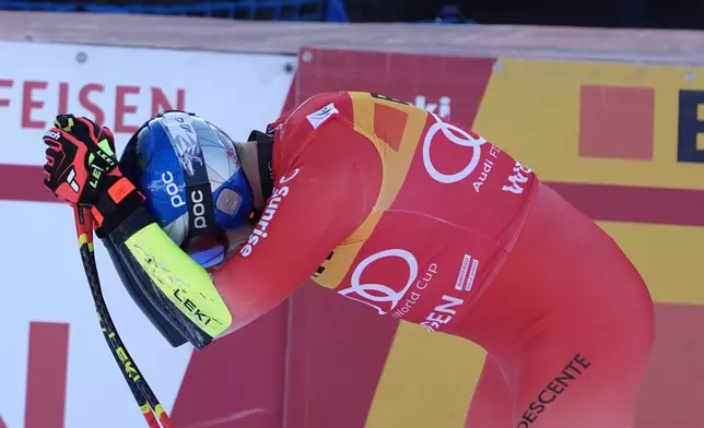 Switzerland's Marco Odermatt reacts at finish line during an alpine ski, men's World Cup super-G, in Wengen, Switzerland, Friday Jan. 16, 2026. (AP Photo/Giovanni Zenoni)