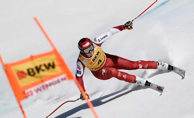 Austria's Stefan Babinsky speeds down the course during an alpine ski, men's World Cup super-G, in Wengen, Switzerland, Friday Jan. 16, 2026. (AP Photo/Gabriele Facciotti)