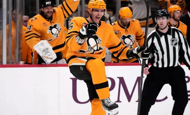 Pittsburgh Penguins defenseman Ryan Shea (5) celebrates his goal during the second period of an NHL hockey game against the Chicago Blackhawks in Pittsburgh, Thursday, Jan. 29, 2026. (AP Photo/Gene J. Puskar)