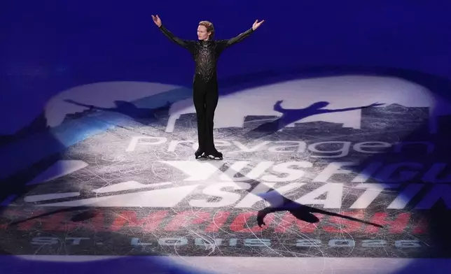 Gold medalist Ilia Malinin arrives for the metal ceremony after the men's free skate competition at the U.S. Figure Skating Championships, Saturday, Jan. 10, 2026, in St. Louis. (AP Photo/Jeff Roberson)