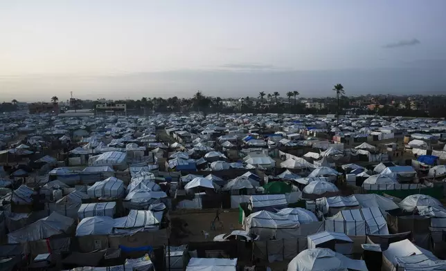 A tent camp for displaced Palestinians stretches across an area in Deir al-Balah, in the central Gaza Strip, Saturday, Jan. 10, 2026. (AP Photo/Abdel Kareem Hana)