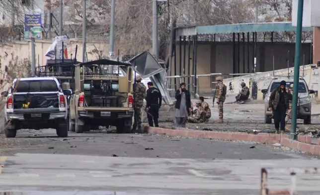 Pakistani army soldiers and other security officials examine a site following militants attack with guns and grenades, in Quetta, Pakistan, Saturday, Jan. 31, 2026. (AP Photo/Arshad Butt)