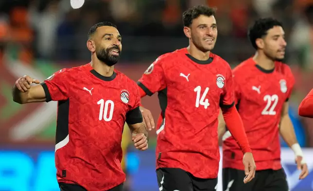 Egypt's Mohamed Salah, left, celebrates after scoring his side's third goal during the Africa Cup of Nations quarterfinal soccer match between Egypt and Ivory Coast, in Agadir, Morocco, Saturday, Jan. 10, 2026. (AP Photo/Mosa'ab Elshamy)