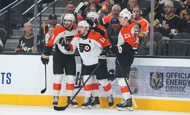 Philadelphia Flyers right wing Travis Konecny (11) celebrates his goal against the Vegas Golden Knights during the first period of an NHL hockey game Monday, Jan. 19, 2026, in Las Vegas. (AP Photo/Candice Ward)