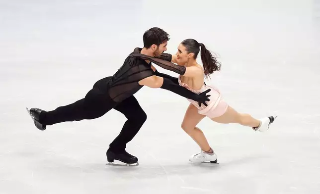 France's Laurence Fournier Beaudry and Guillaume Cizeron compete during the Ice Dance Rhythm Dance segment on day three of the ISU European Figure Skating Championships in Sheffield, England, Friday, Jan. 16, 2026. (Mike Egerton/PA via AP)