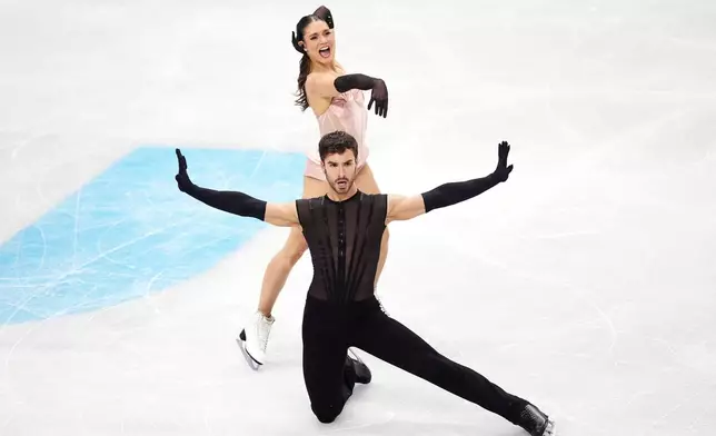 France's Laurence Fournier Beaudry and Guillaume Cizeron compete during the Ice Dance Rhythm Dance segment on day three of the ISU European Figure Skating Championships in Sheffield, England, Friday, Jan. 16, 2026. (Mike Egerton/PA via AP)