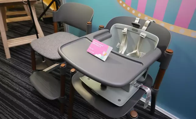 A Baby Products Fair exhibitor showcases a portable booster seat that transforms from a comfortable armchair for infants and toddlers into a foldable high chair for preschool-aged children. Its lightweight design makes it easy to carry. Photo source: HKTDC