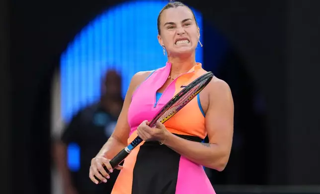 Aryna Sabalenka of Belarus reacts during her first round match against Tiantsoa Rakotomanga Rajaonah of France at the Australian Open tennis championship in Melbourne, Australia, Sunday, Jan. 18, 2026. (AP Photo/Dita Alangkara)