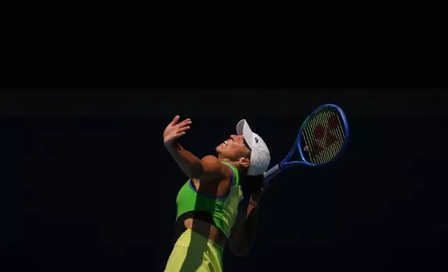 Madison Keys of the U.S. serves to Oleksandra Oliynykova of Ukraine during their first round match at the Australian Open tennis championship in Melbourne, Australia, Tuesday, Jan. 20, 2026. (AP Photo/Asanka Brendon Ratnayake)