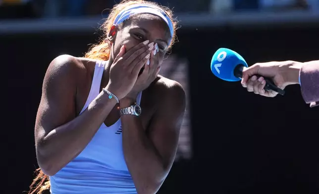 Coco Gauff of the U.S. reacts during an on court interview following her second round match against Olga Danilovic of Serbia at the Australian Open tennis championship in Melbourne, Australia, Wednesday, Jan. 21, 2026. (AP Photo/Asanka Brendon Ratnayake)