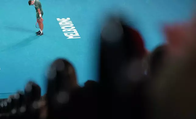 Hamad Medjedovic of Serbia reacts during his second round match against Alex de Minaur of Australia at the Australian Open tennis championship in Melbourne, Australia, Wednesday, Jan. 21, 2026. (AP Photo/Dita Alangkara)